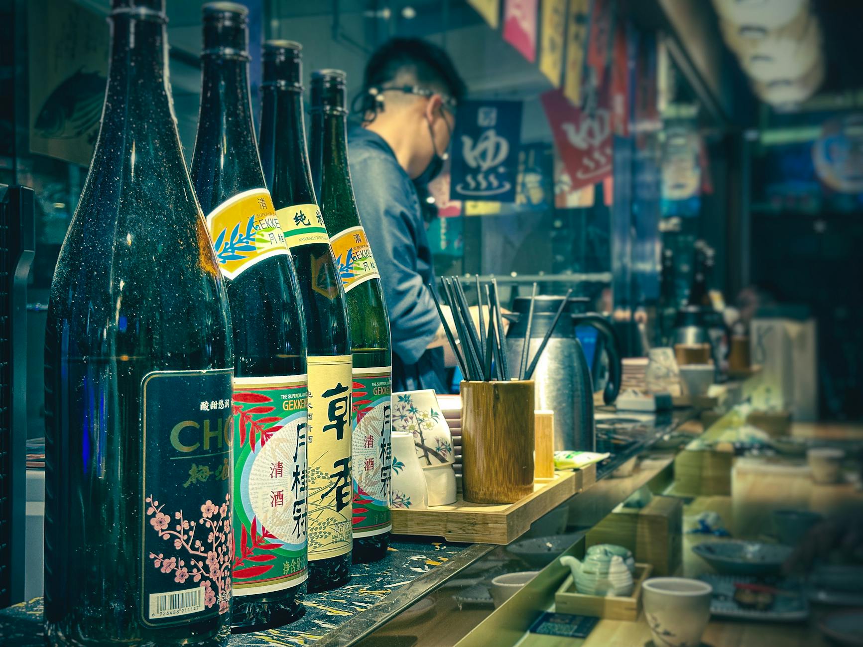 row of bottles in bar